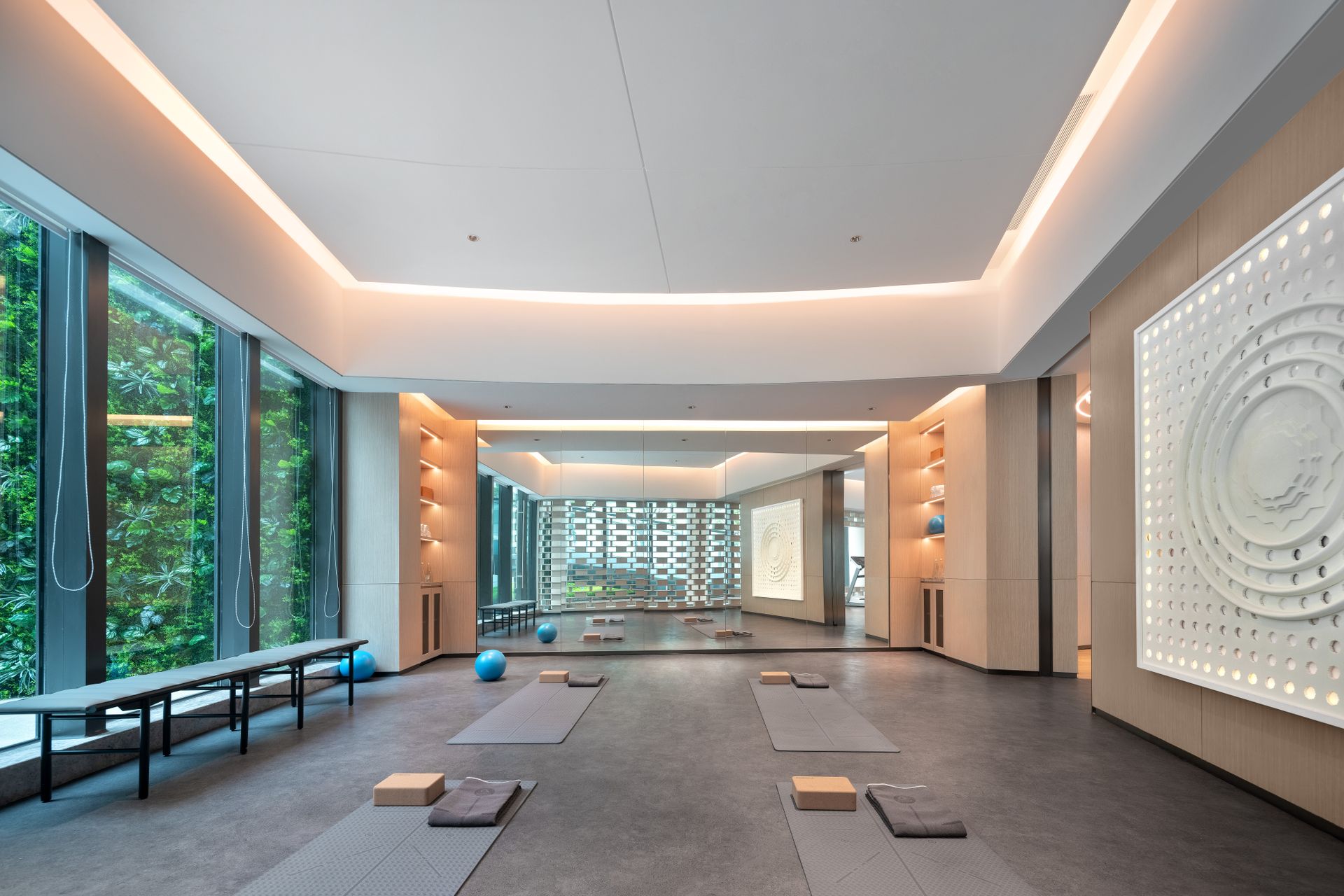 Meditation interior with natural light, clear floor space and mandala-style wall detailing. An interior reference; compass direction and spiritual outcomes cannot be inferred from a photograph.