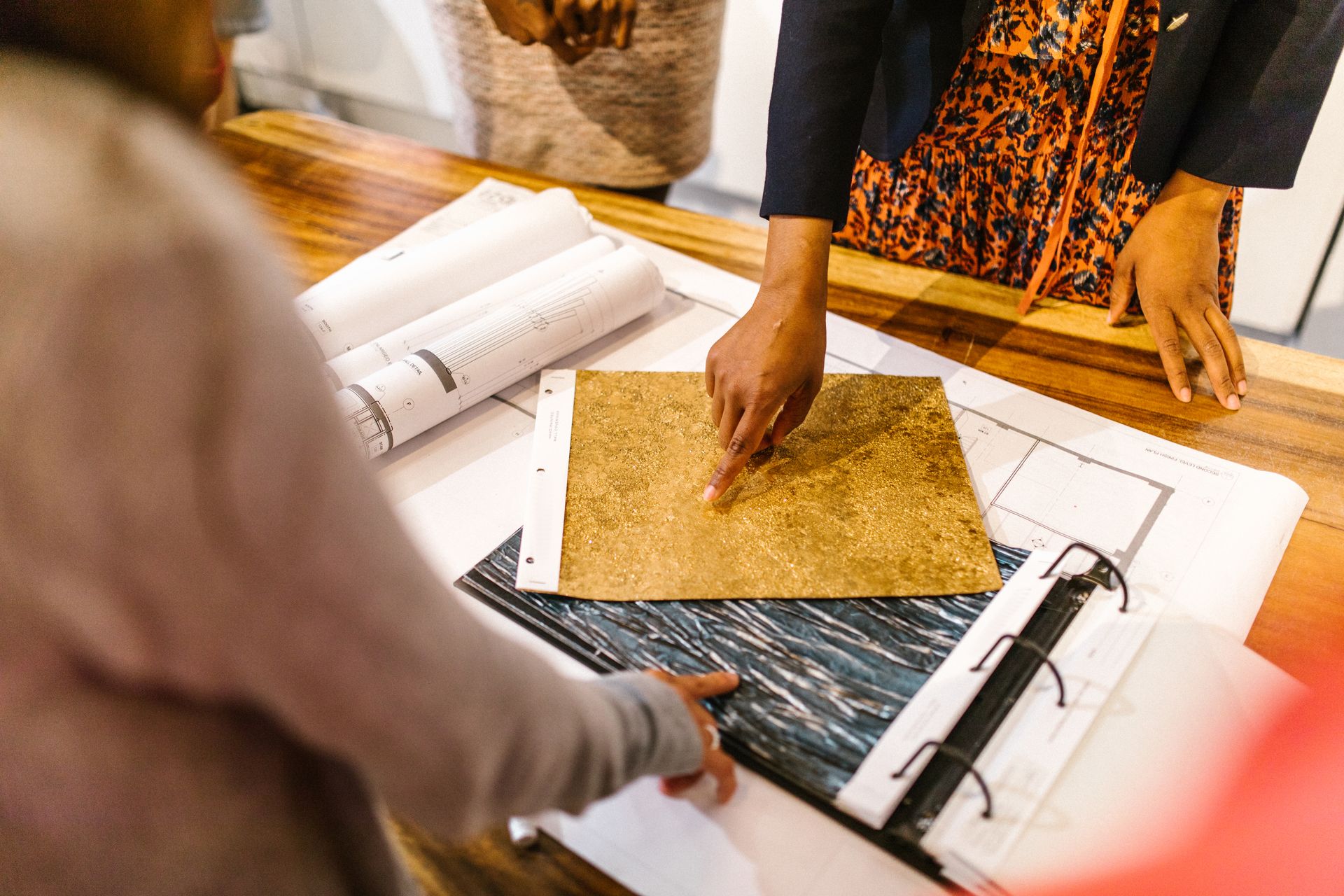 Designers comparing material samples for an interior specification